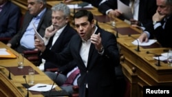 Greek Prime Minister Alexis Tsipras answers a question on the results of the latest Eurogroup during the Prime Minister's Question Time at the parliament in Athens, Greece, Feb. 24, 2017.
