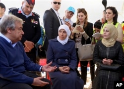 U.N. Secretary-General Antonio Guterres speaks to refugees during a visit the U.N.-run Zaatari camp for Syrian refugees, in northern Jordan, March 28, 2017. Guterres is to attend an annual Arab summit in Jordan on March 29.