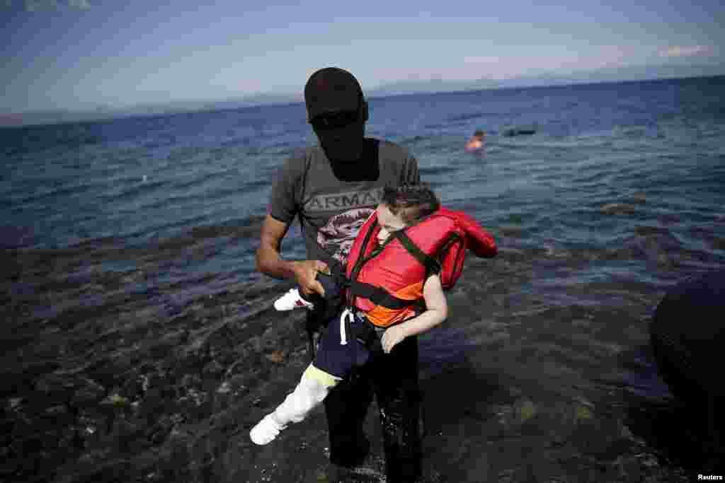 Migrants and refugees continue to make the sometimes dangerous journey to Europe. These Syrian refugees arrived in a small boat on the Greek island of Lesbos.