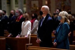 President-elect Joe Biden is joined his wife Jill Biden as they celebrate Mass at the Cathedral of St. Matthew the Apostle during Inauguration Day ceremonies Wednesday, Jan. 20, 2021, in Washington. (AP Photo/Evan Vucci)