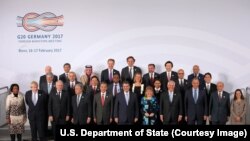 U.S. Secretary of State Rex Tillerson joins his counterparts for a family photo at the G-20 Foreign Ministers’ Meeting in Bonn, Germany, on February 16, 2017. This is his first official trip as Secretary of State. [State Department photo/ Public Domain]