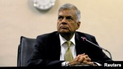 FILE - Sri Lankan Prime Minister Ranil Wickremesinghe looks on at a news conference in parliament in Colombo, Sri Lanka, April 4, 2018.