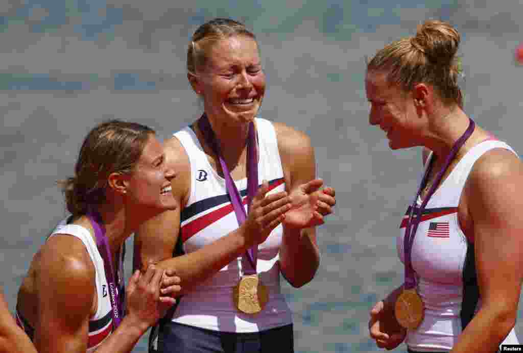 Team USA reacts after winning the gold medals at the victory ceremony after the women's eight finals rowing event during the London 2012 Olympic Games at Eton Dorney August 2, 2012. 