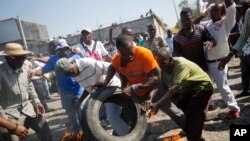 Manifestantes em Port-au-Prince, esta semana.
