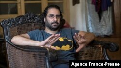 FILE - Egyptian activist and blogger Alaa Abdel Fattah gives an interview at his home in Cairo, Egypt, May 17, 2019. 