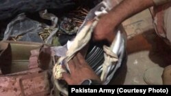 Pakistan security forces recovered ammunition and other weapons during an operation on May 16, 2018 in Baluchistan.