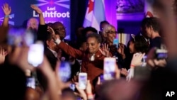 Lori Lightfoot waves to supporters as she walks to the stage at her election night party Tuesday, April 2, 2019, in Chicago. Lori Lightfoot elected Chicago mayor, making her the first African-American woman to lead the city.
