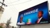 An electronic billboard displaying a campaign poster of leading opposition All Progressives Congress presidential candidate Mohammadu Buhari and his running mate Yemi Osinbajo in the Ikoyi district of Lagos, Nigeria, Feb. 24, 2015.