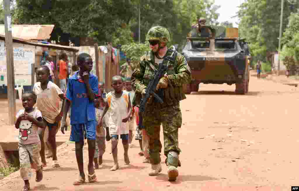 An Estonian soldier of the European Union Force patrols in the Central African Republic city of Bangui.