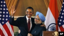 U.S. President Barack Obama, left, and Indian Prime Minister Manmohan Singh, embrace following a joint statement and press conference at Hyderabad House in New Delhi, India, Monday, Nov. 8, 2010. 