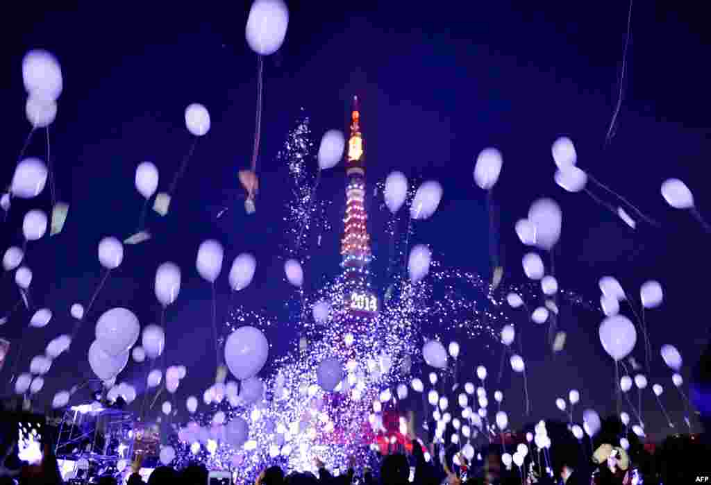 People release balloons to celebrate the New Year during an annual countdown ceremony in Tokyo, Japan. Some 2,000 balloons were released in the air, carrying with people's wishes.