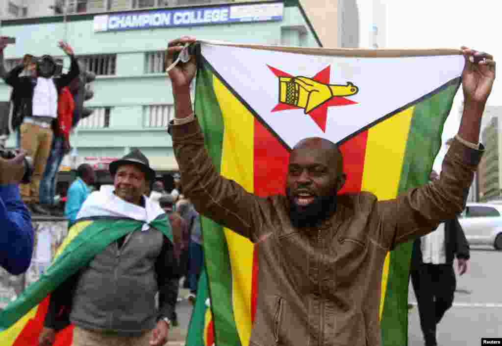 Protesters gather calling for Zimbabwean President Robert Mugabe to step down, in Harare, Zimbabwe, Nov. 18, 2017.