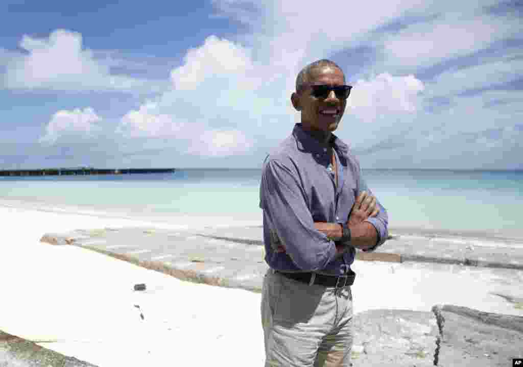 President Barack Obama looks stands at Turtle Beach to speak to the media as he tours Midway Atoll in the Papahanaumokuakea Marine National Monument, Northwestern Hawaiian Islands.