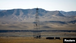 FILE - An oil installation in an area near Herat, Afghanistan, Dec. 17, 2009. A Chinese company has invested in oil production in Afghanistan's Amu Darya basin.