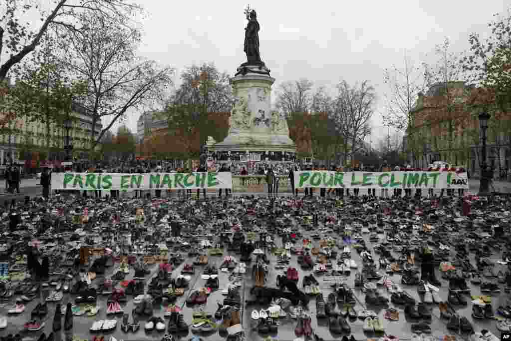 Hundreds of pairs of shoes are displayed at the place de la Republique, in Paris, France, as part of a symbolic and peaceful rally called by the NGO Avaaz &quot;Paris sets off for climate. More than 140 world leaders are gathering around Paris for high-stakes climate talks that start on Nov. 30, 2015, and activists are holding marches and protests around the world to urge them to reach a strong agreement to slow global warming.