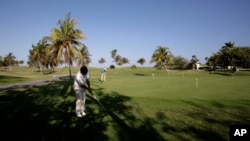 FILE - Players are seen on an existing golf course in Varadero, Cuba, in an April 24, 2010, photo.