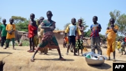 FILE - Children are seen posing in Blaram in northern Cameroon on March 1, 2013.