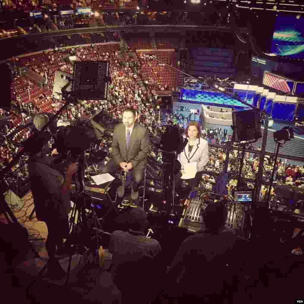 VOA Serbian's Bratislav Djordjevic (L) and VOA Spanish's Lina Correa (R) reporting from the DNC.