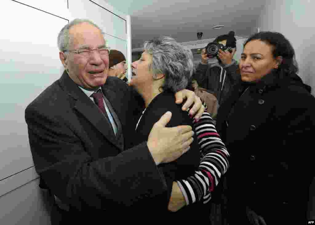 Human rights activist and lawyer Mokhtar Trifi and Basma Chokri, mourn Chokri Belaid, Tunis, Feb. 6, 2013.