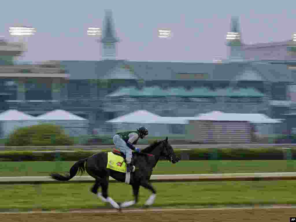 Exercise rider Peter Shelton rides Kentucky Derby entrant Itsmyluckyday for a workout at Churchill Downs, in Louisville. 