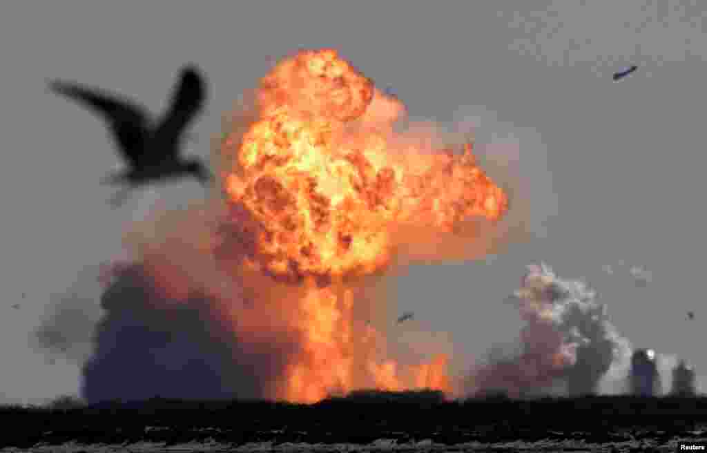 The SpaceX Starship SN9 explodes into a fireball after its high altitude test flight from test facilities in Boca Chica, Texas, Feb. 2, 2021.