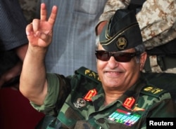 FILE - Abdel Fattah Younes gestures as he arrives at Green Square in the Kish, Benghazi, July 6, 2011, to demonstrate against Moammar Gadhafi and his regime.