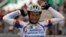 FILE - Androni-Diquigiova team rider Michele Scarponi of Italy celebrates his victory as he crosses the finish line of the 195-km 19th stage of the Giro d'Italia cycling race from Brescia to Aprica May 28, 2010. Scarponi was killed Saturday in a training