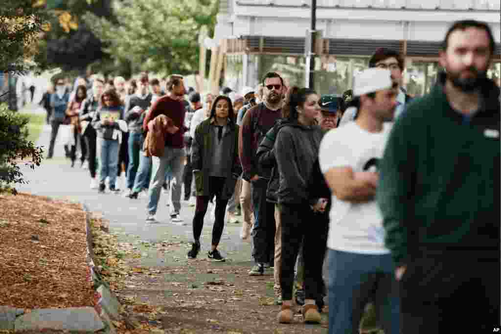 People wait in line to vote on Election Day, Nov. 5, 2024, in the East Boston neighborhood of Boston,&nbsp;Massachusetts.