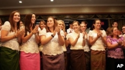 59 new Peace Corps volunteers are sworn in during a ceremony at Phnom Penh's Daegu Gyeong Buk Cultural Center on Monday, October 3, 2011.