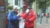 City ambassador Wayne Alexis helps a tourist find his way in San Francsico, California. (Photo courtesy Union Square BID)