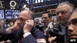 Traders on the floor of the New York Stock Exchange 