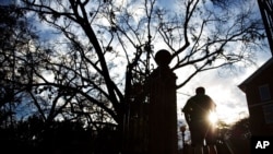 FILE - A pedestrian is seen on the University of Georgia campus, in Athens, Ga., Dec. 16, 2015.