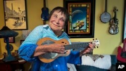 D'yan Forest, 89, who holds the Guinness World Record for Oldest Working Female Comedian, poses in her apartment, July 19, 2024, in New York. Forest, a bawdy, ukulele-playing firecracker of a woman, is furious hearing people call for Biden to give up and eagerly supports him.