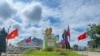 FILE - This photo taken on August 10, 2024 shows Myanmar National Democratic Alliance Army flags in Myanmar's northern Shan State. The group said December 3 it is ready for talks with the junta to end more than a year of fighting that has ravaged areas along the Chinese border.