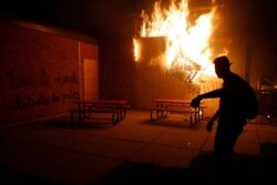 People set a fire during continued protest May 29, 2020, in Minneapolis.