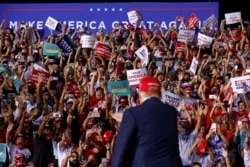 U.S. President Donald Trump arrives at a campaign rally at Miami-Opa Locka Executive Airport in Opa-Locka, Florida.