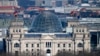 A European and German flags wave at the Reichstag building, the house of German parliament Bundestag at the eve of the national election in Berlin, Feb. 22, 2025.