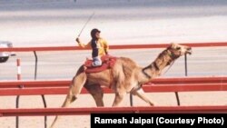 Ramesh Jaipal, who was sold into slavery as a child, is seen racing a camel in Dubai at age 6.