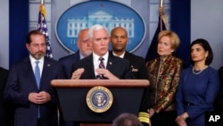 FILE - Vice President Mike Pence, flanked by administration officials, including Health and Human Services Secretary Alex Azar (L), speaks about the coronavirus outbreak, in the briefing room of the White House in Washington, March, 9, 2020.