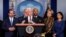FILE - Vice President Mike Pence, flanked by administration officials, including Health and Human Services Secretary Alex Azar (L), speaks about the coronavirus outbreak, in the briefing room of the White House in Washington, March, 9, 2020.
