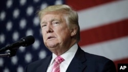 FILE - Republican presidential candidate Donald Trump speaks at a rally in Manheim, Pennsylvania, Oct. 1, 2016.