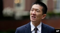 FILE - Hawaii Attorney General Doug Chin talks to reporters, May 15, 2017, outside a federal courthouse in Seattle.