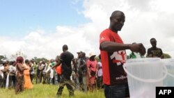 A Kenyan casts his ballot in Nairobi during the primary nominations ahead of this year general election to be held in March, January 17, 2013.