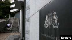 A man walks outside the British Cosulate-general office in Hong Kong, Aug. 20, 2019. 