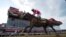 Flavien Prat atop Rombauer crosses the finish line to win the Preakness Stakes horse race at Pimlico Race Course, May 15, 2021, in Baltimore. 