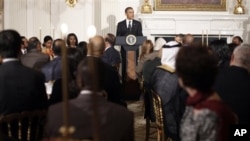 President Barack Obama hosts an Iftar dinner, the meal that breaks the dawn-to-dusk fast for Muslims during the holy month of Ramadan, in the State Dining Room of the White House in Washington, Wednesday, Aug. 10, 2011.