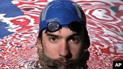 Olympic gold medalist Michael Phelps posing in the Belmont Plaza Olympic Pool in Long Beach, Calif. (Jan 2008 file photo)