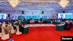 FILE — West African leaders gather for Economic Community of West African States Head of States and Government meeting in Abuja, Nigeria, August 10, 2023.