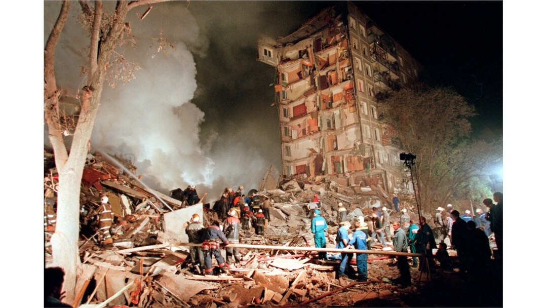FILE - Rescuers and firefighters work at the site of a massive explosion that destroyed a nine-story apartment building in the southeastern part of Moscow in September 1999.