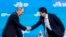 Russia's President Vladimir Putin, left, shakes hands with Japan's Prime Minister Shinzo Abe at a plenary session titled "The Russian Far East: Creating a New Reality" at the 2017 Eastern Economic Forum in Vladivostok, Russia, Sept. 7, 2017. 